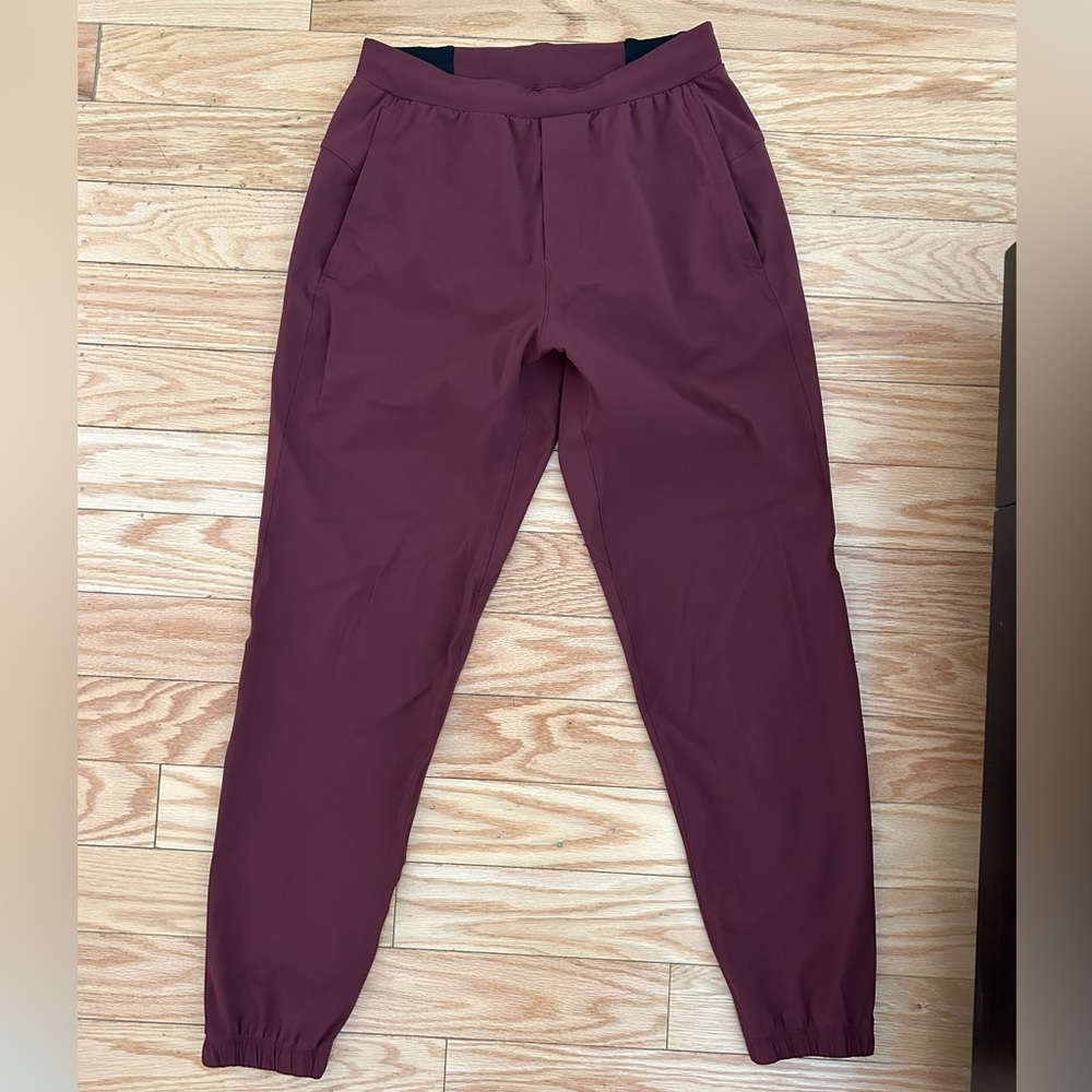 Lululemon men’s joggers in burgundy, size xs. Never worn.